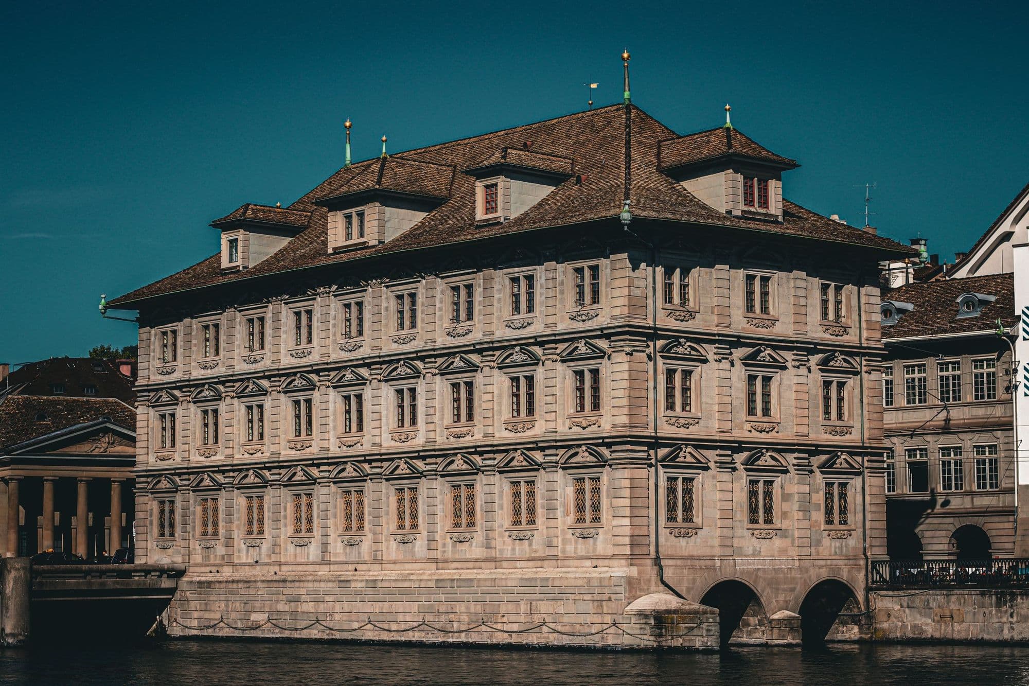 Zürich's town hall on the Limmat river at blue hour.